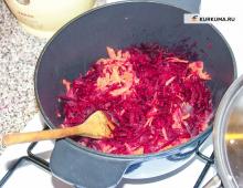 Classic vegetarian borscht with candles